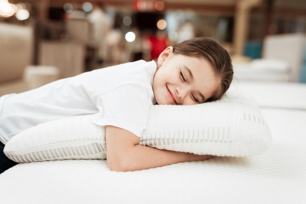 https://london.dandsmattress.com/wp-content/uploads/2021/06/happy-young-girl-sleeping-with-pillow-mattress_99043-4998.jpg